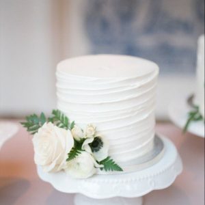 Icing Cake with White Flowers
