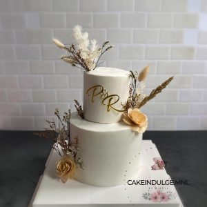 White Cake with Dried Flowers and Acrylic Initials Topper